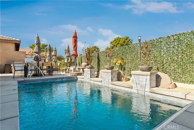 a view of swimming pool with outdoor seating