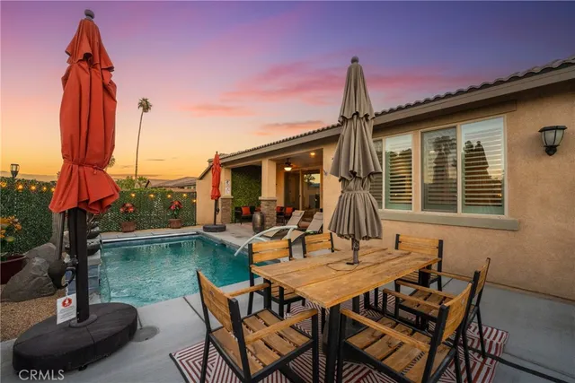 a view of a swimming pool with chairs