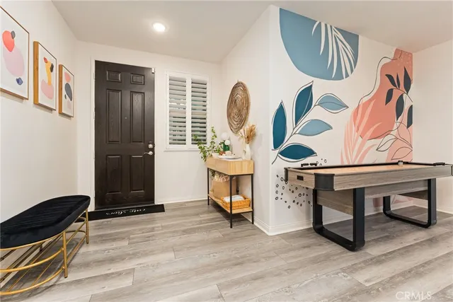 a large kitchen with a table and chairs