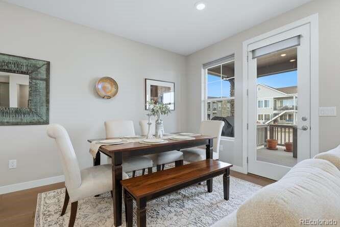 1925 Canyonpoint Place Castle Pines, CO 80108 - Photo 15 of 50 a living room with furniture a rug and a window
