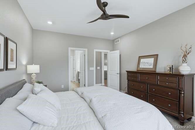 1925 Canyonpoint Place Castle Pines, CO 80108 - Photo 24 of 50 a bedroom with a bed and a dresser