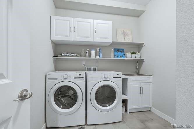 1925 Canyonpoint Place Castle Pines, CO 80108 - Photo 28 of 50 a utility room with dryer and washer