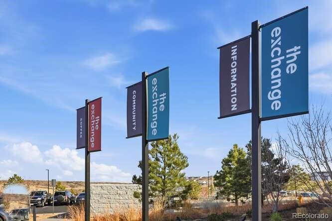 1925 Canyonpoint Place Castle Pines, CO 80108 - Photo 43 of 50 a street sign on a wall next to road