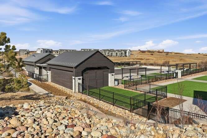 1925 Canyonpoint Place Castle Pines, CO 80108 - Photo 46 of 50 a view of a terrace with a garden