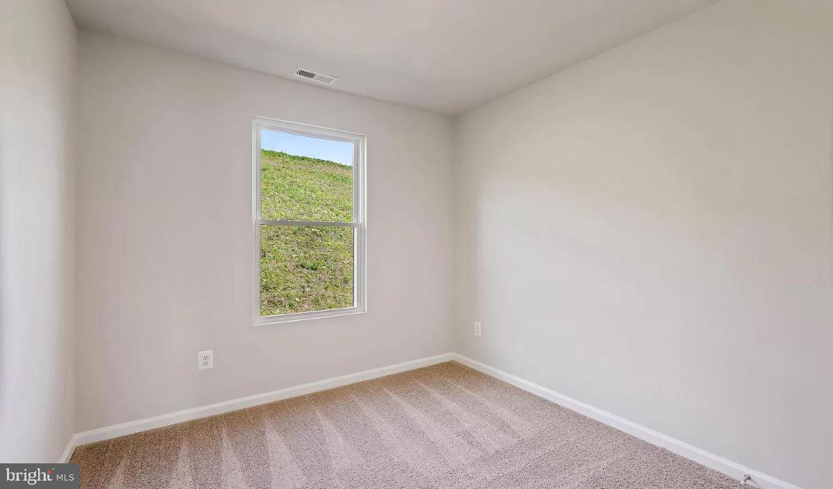 58 Cramsford Street Falling Waters, WV 25419 - Photo 8 of 9 an empty room with a window