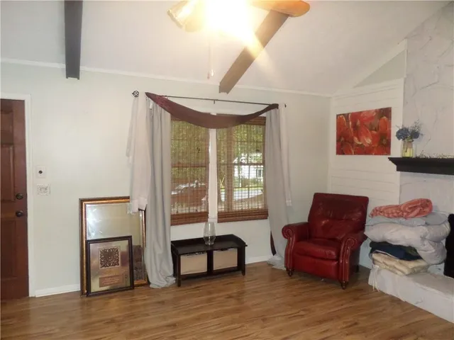 a bedroom with furniture and a window