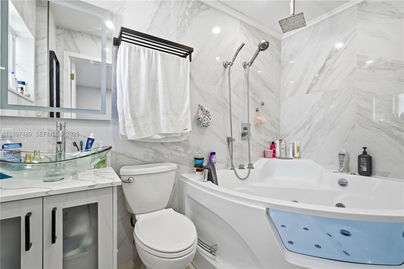13765 Southwest 54th Lane Miami, FL 33175 - Photo 11 of 30 a bathroom with a sink a toilet and a mirror