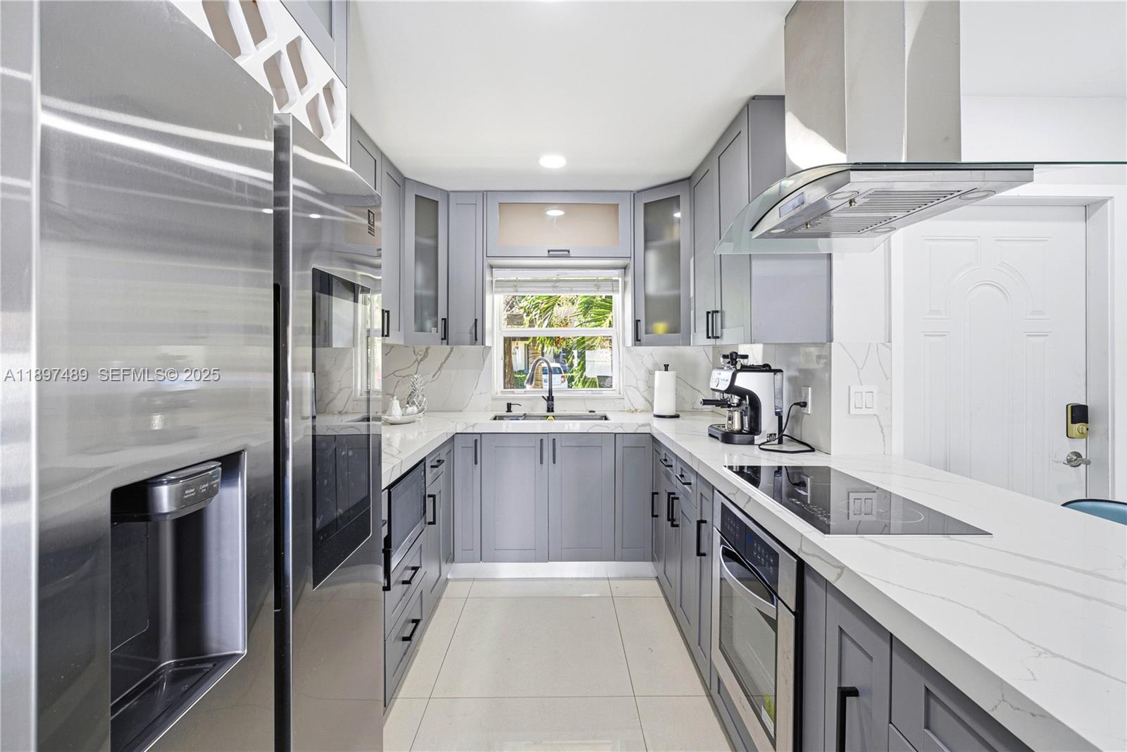 13765 Southwest 54th Lane Miami, FL 33175 - Photo 13 of 30 a kitchen with granite countertop a sink stainless steel appliances and cabinets