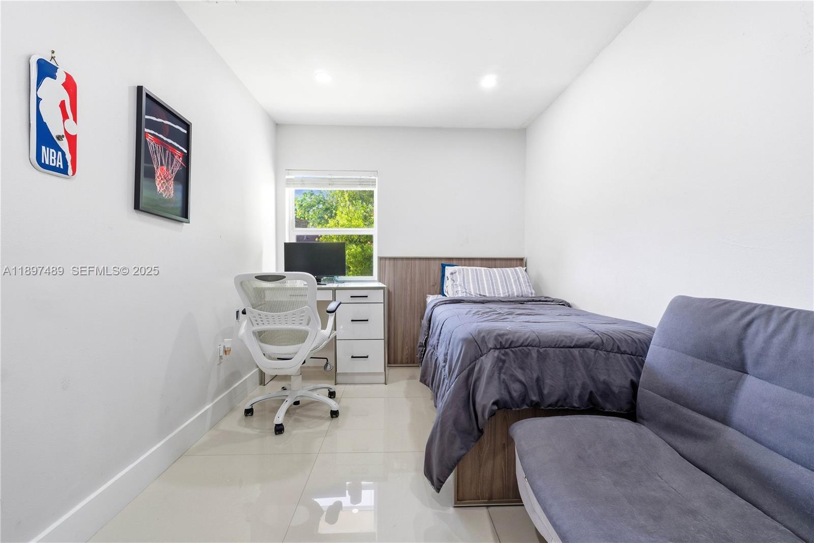 13765 Southwest 54th Lane Miami, FL 33175 - Photo 16 of 30 a bedroom with a bed and furniture