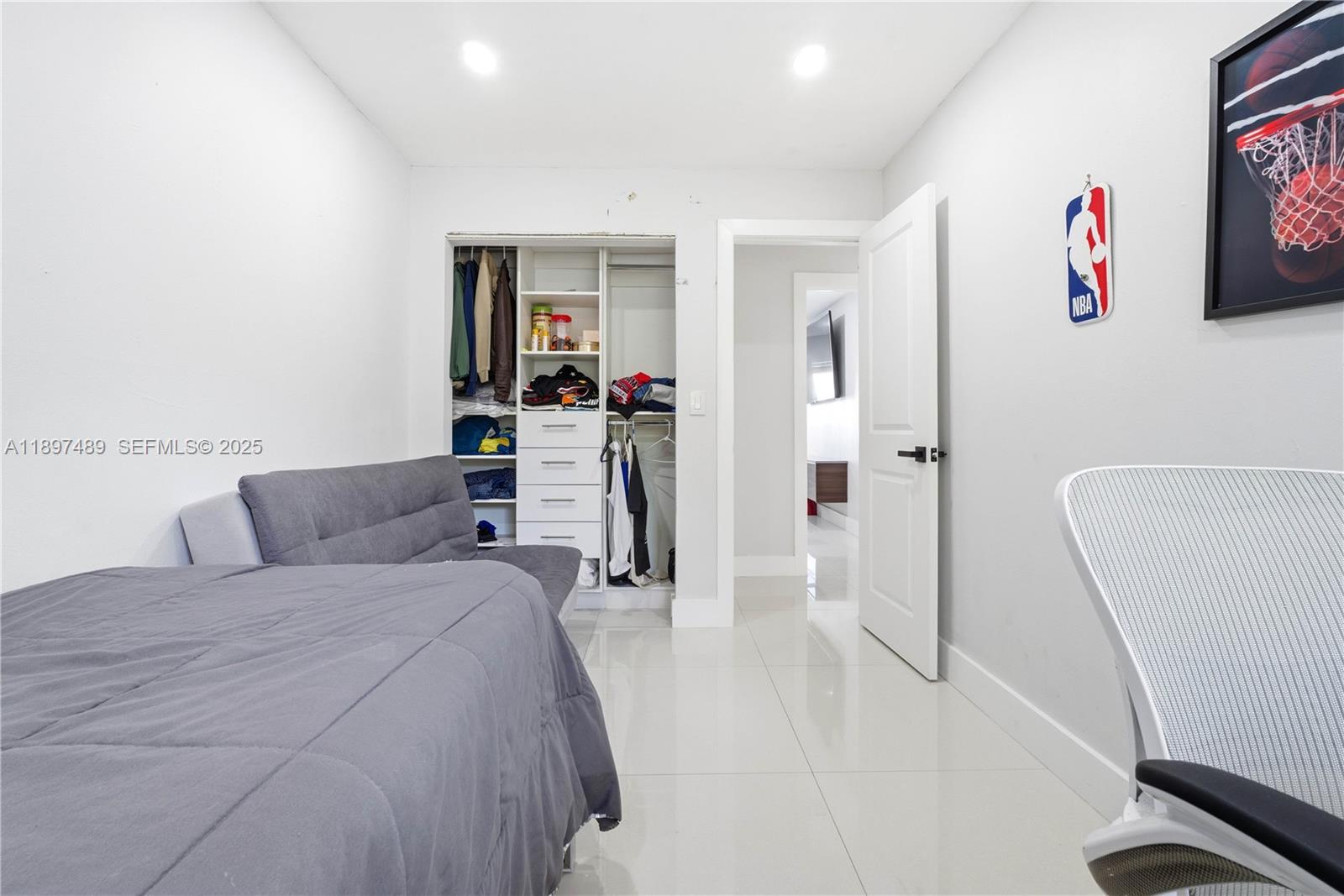 13765 Southwest 54th Lane Miami, FL 33175 - Photo 17 of 30 a bedroom with a bed and a couch