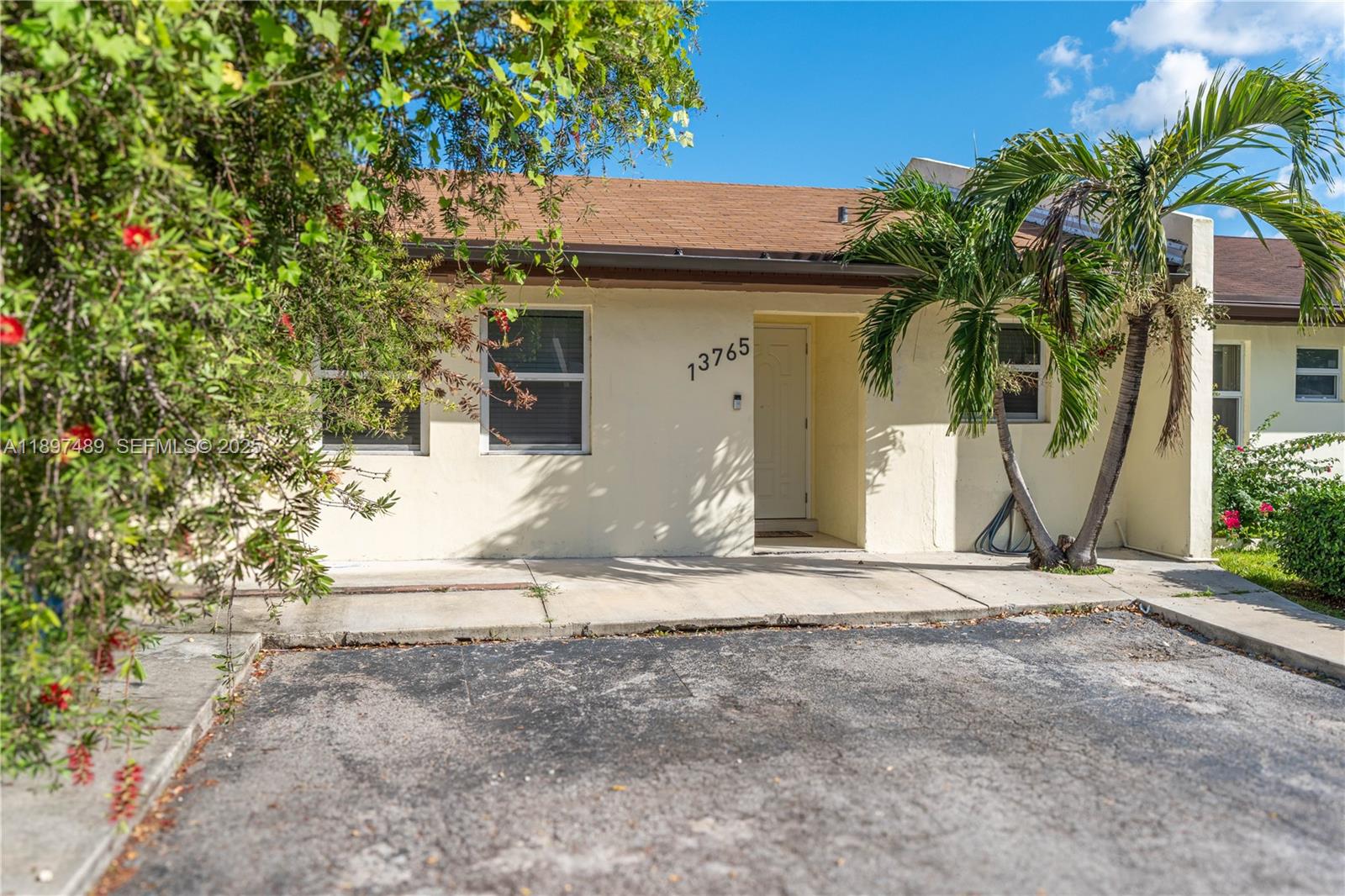 13765 Southwest 54th Lane Miami, FL 33175 - Photo 24 of 30 a house with a tree in front of it