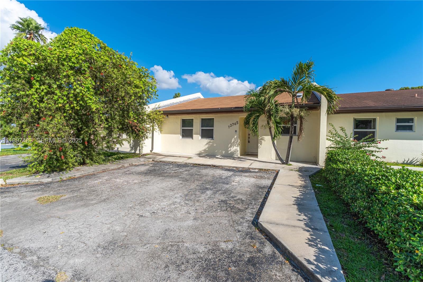 13765 Southwest 54th Lane Miami, FL 33175 - Photo 25 of 30 front view of a house with a yard