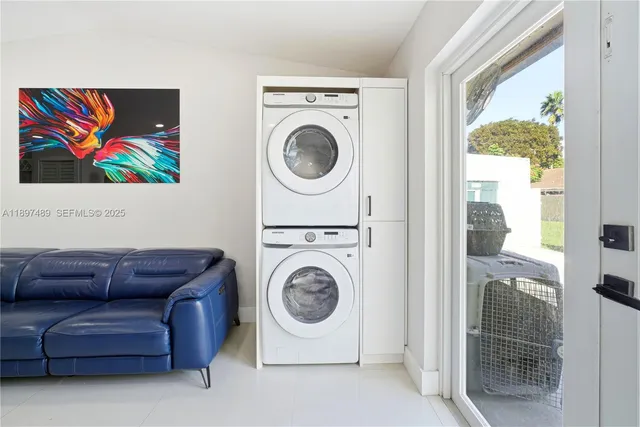 a living room with furniture and a washer