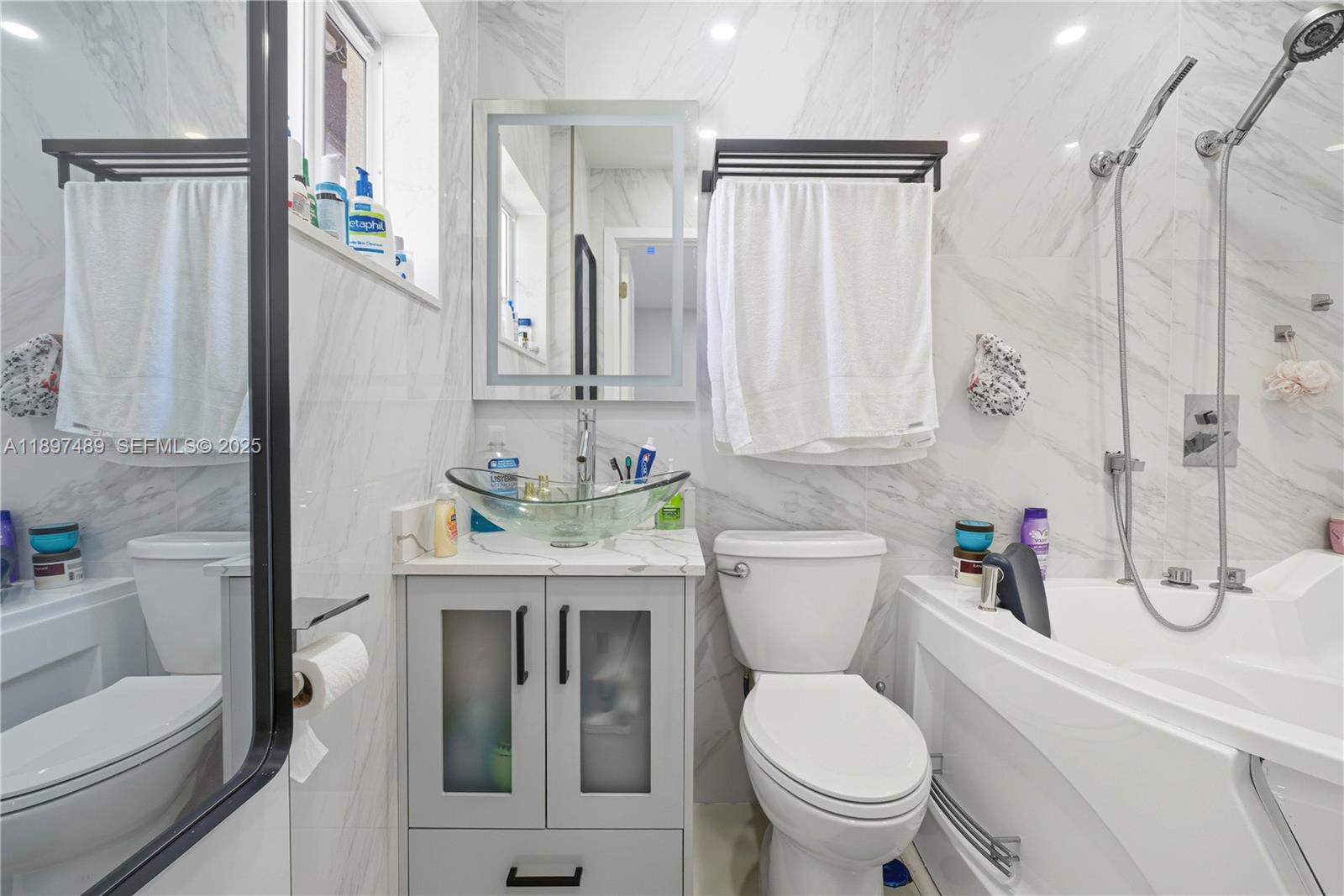 13765 Southwest 54th Lane Miami, FL 33175 - Photo 10 of 30 a bathroom with a sink a toilet and shower