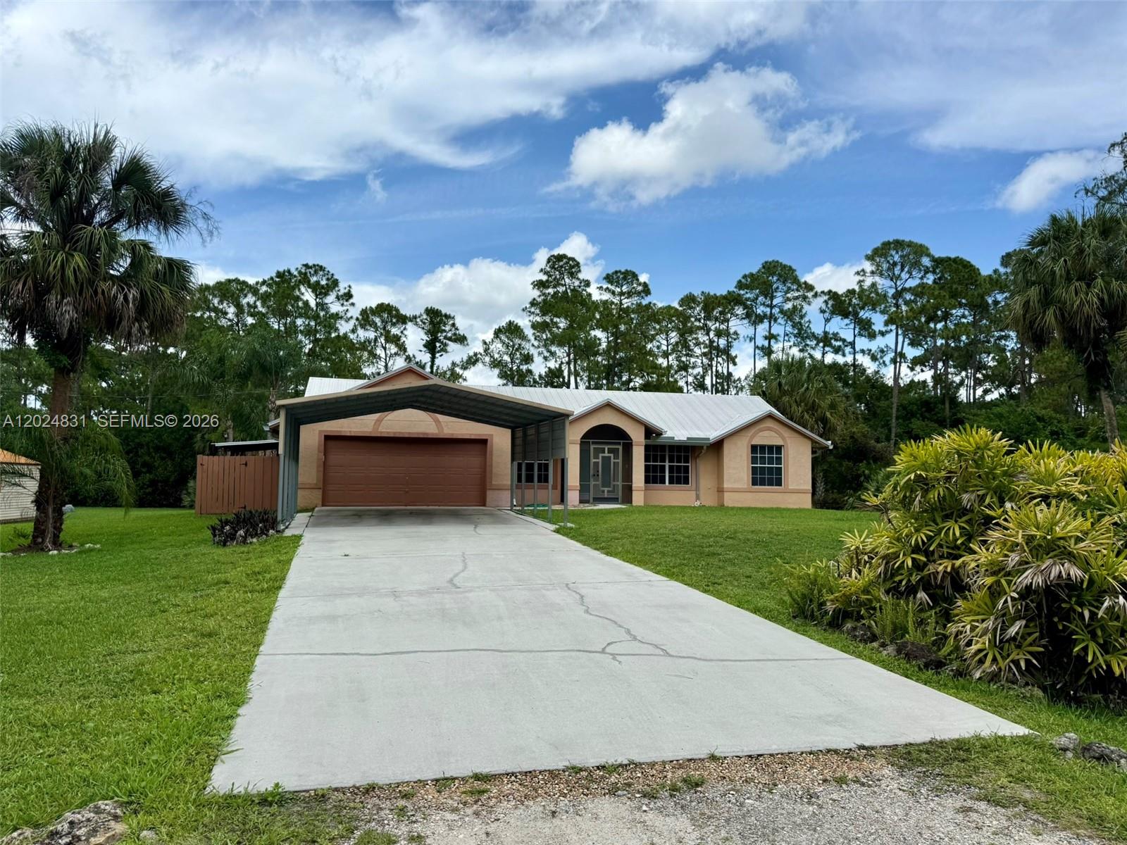 15819 76th Road North Loxahatchee, FL 33470 - Photo 1 of 45 a front view of a house with garden