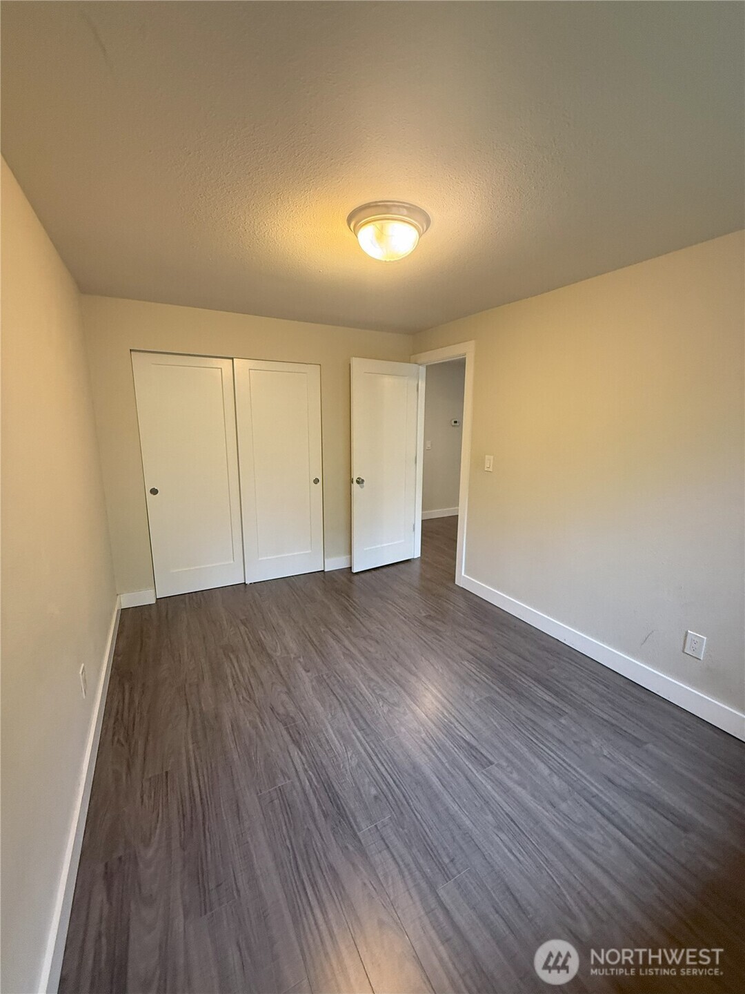 8820 Prentice Avenue Gig Harbor, WA 98332 - Photo 11 of 13 a view of empty room with wooden floor