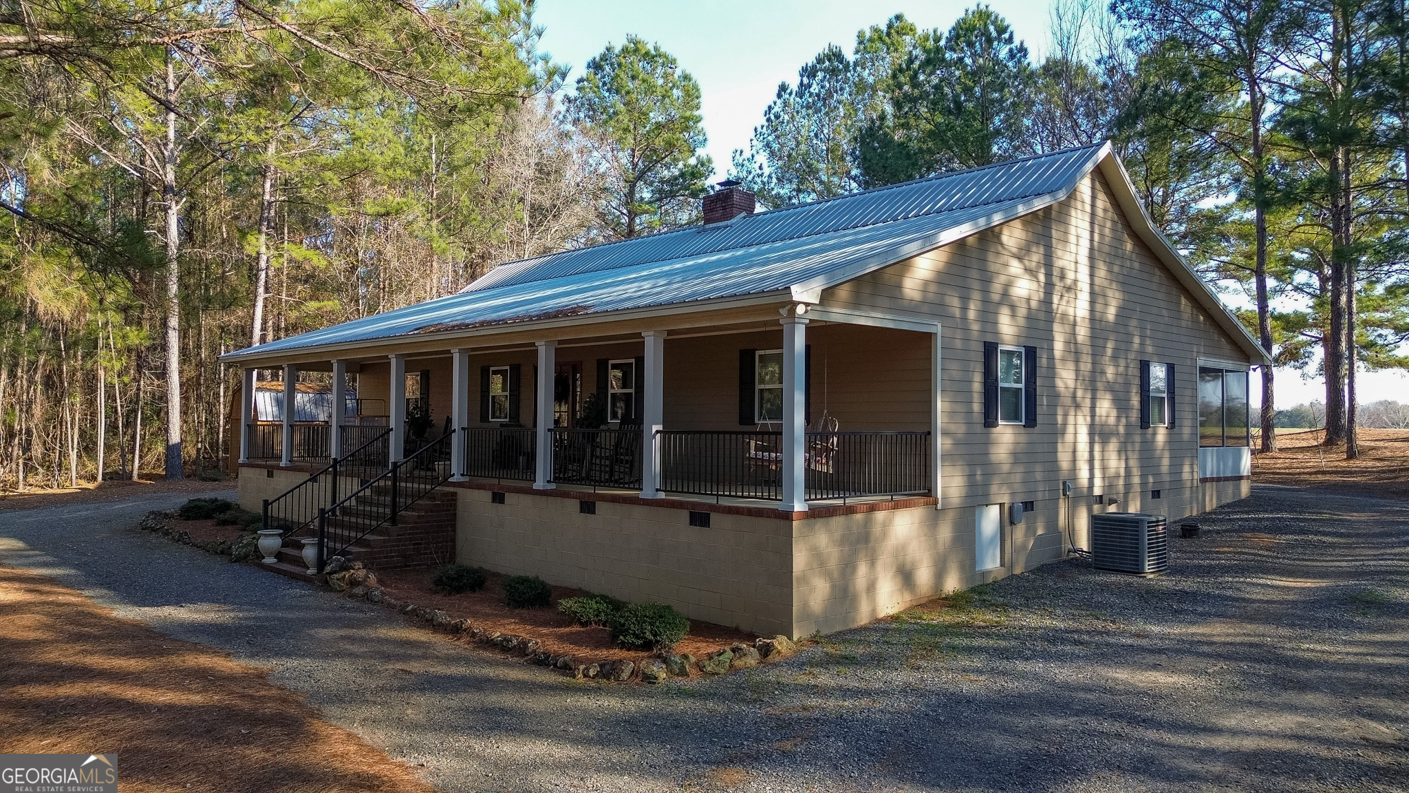 721 Thrasher Road Plains, GA 31780 - Photo 1 of 27 a view of a house with a large window and wooden fence