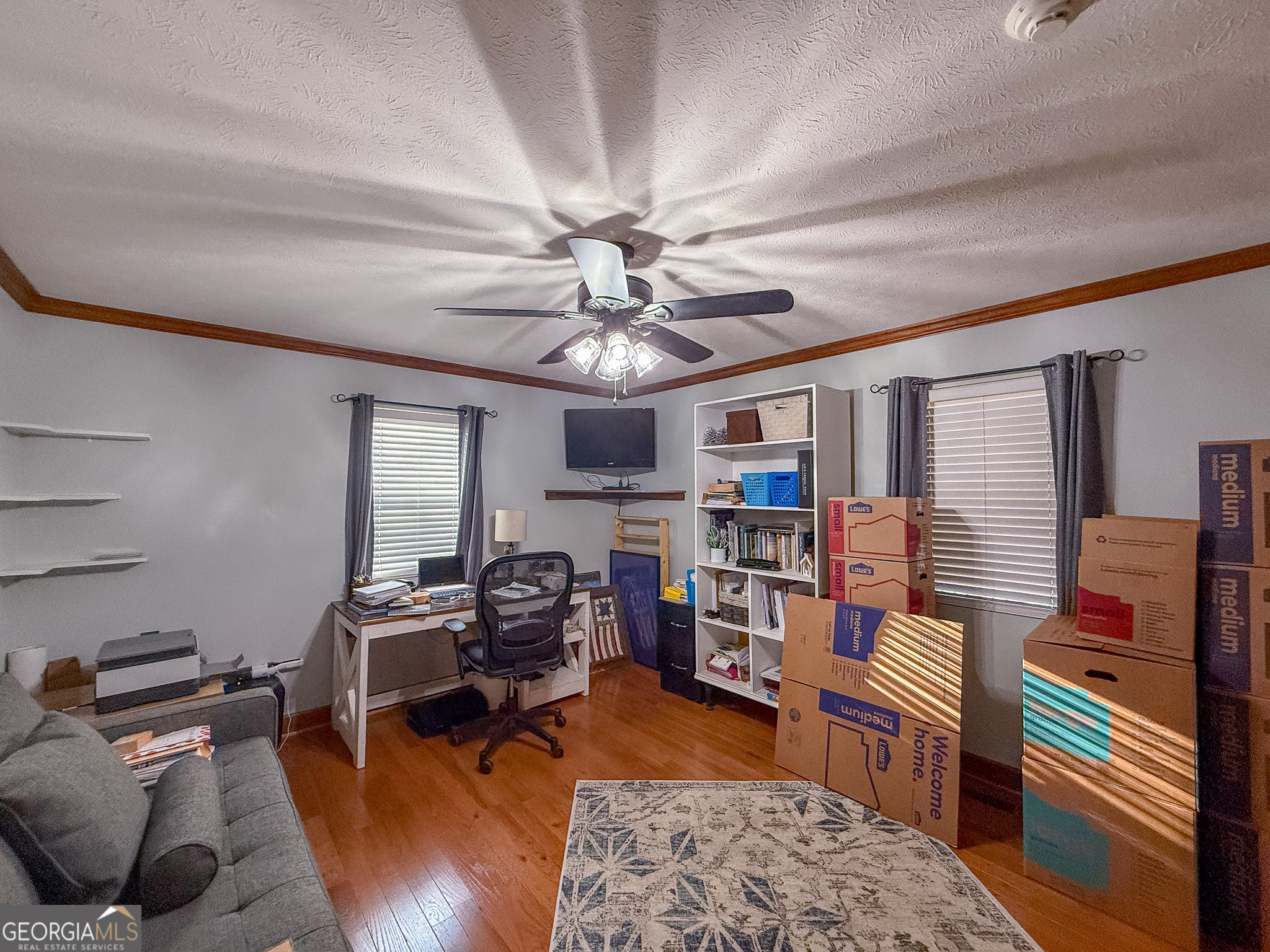 721 Thrasher Road Plains, GA 31780 - Photo 15 of 27 a living room with furniture and a flat screen tv
