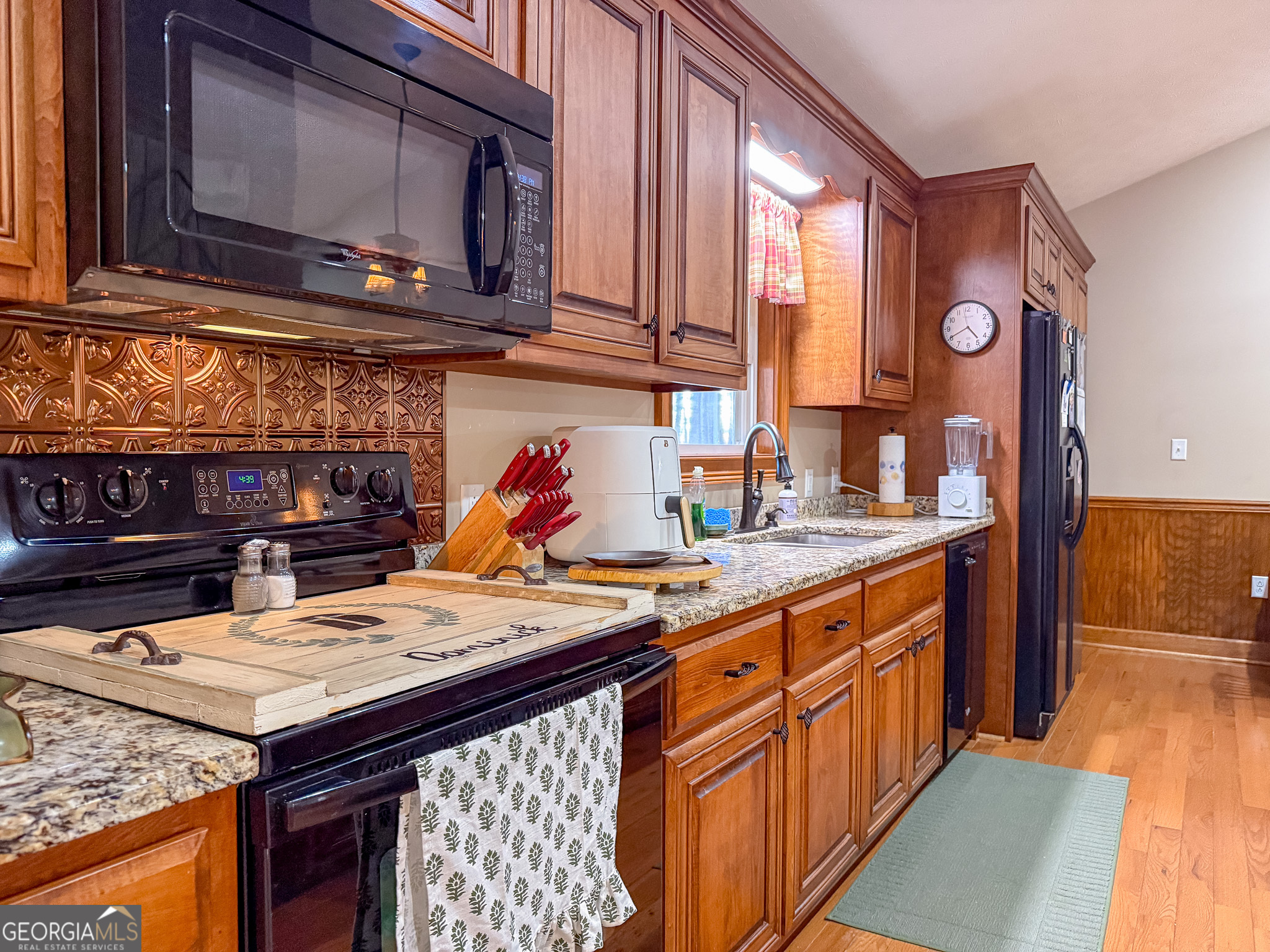 721 Thrasher Road Plains, GA 31780 - Photo 10 of 27 a kitchen with a sink a stove and cabinets