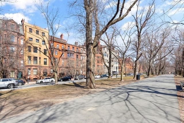 a street view with tall buildings