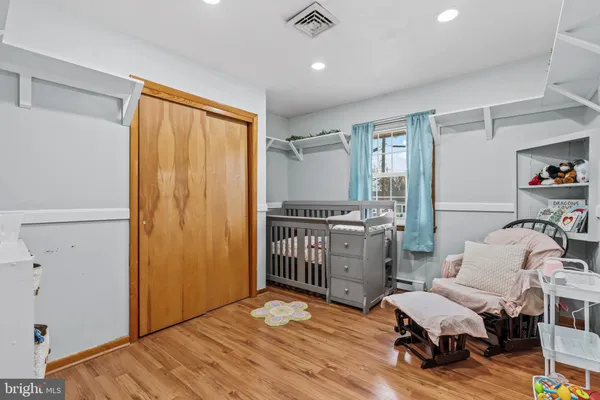 a bedroom with furniture and a window