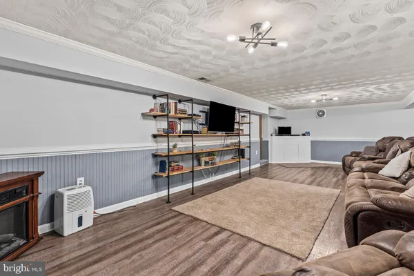 a living room with furniture and natural light