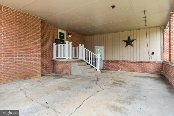 a view of a hallway with stairs