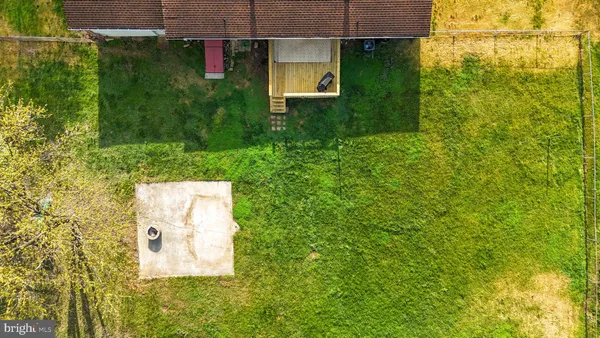 a house with trees in the background