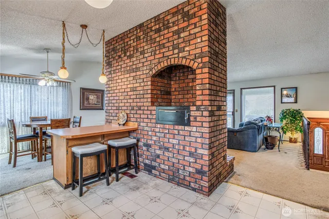 a brick room with chairs