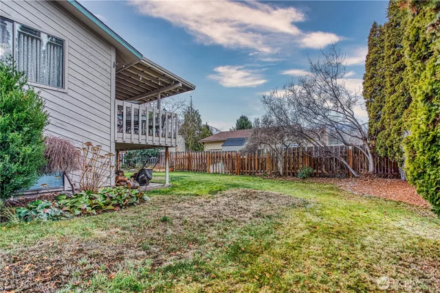 a backyard of a house with lots of green space