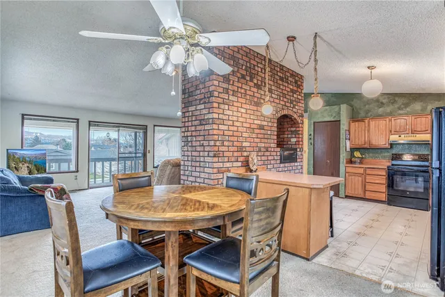 a view of a dining room with furniture and window