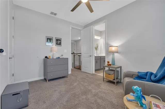 a view of living room filled with furniture and rug