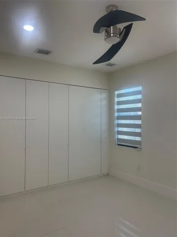 a view of a livingroom and a window