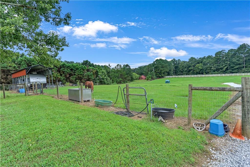 3400 North Sharon Church Road Loganville, GA 30052 - Photo 26 of 53 a view of a garden with a slide