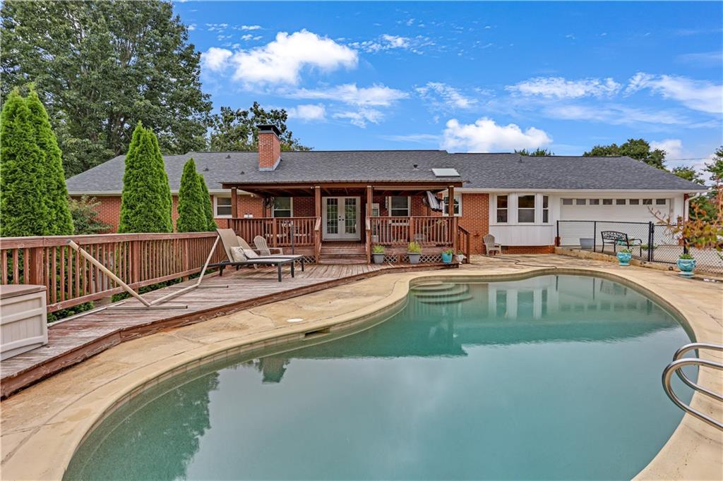 3400 North Sharon Church Road Loganville, GA 30052 - Photo 28 of 53 a view of a house with swimming pool