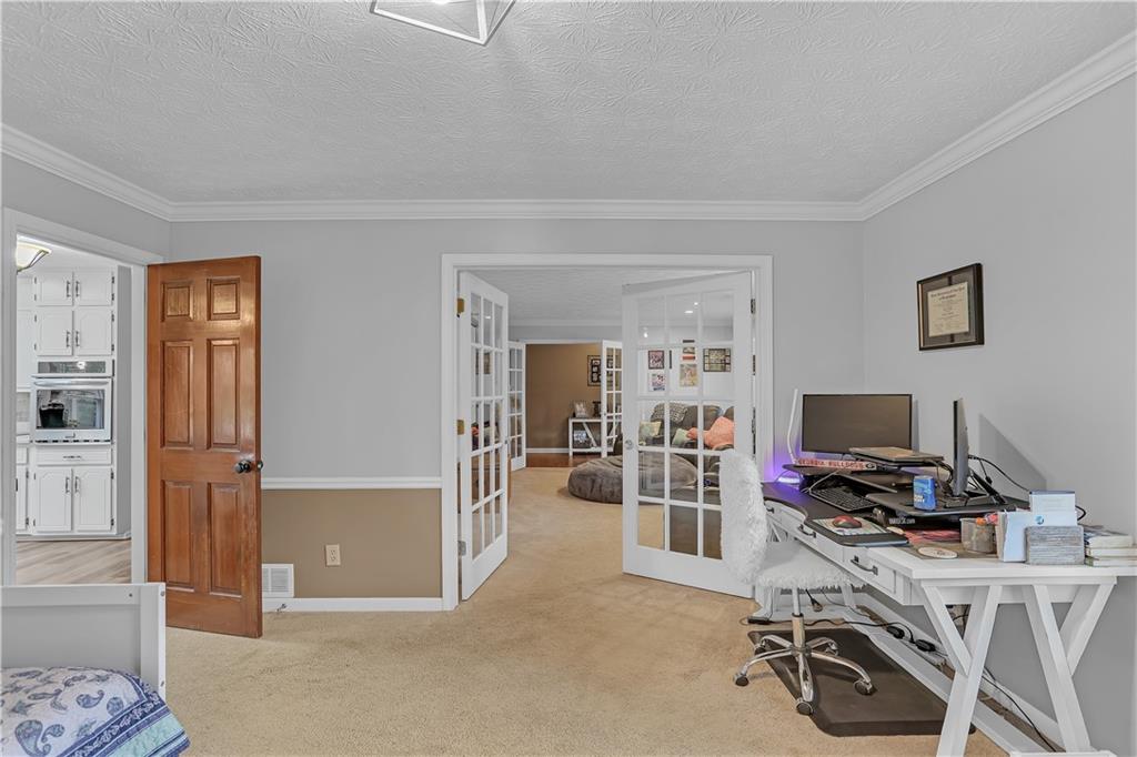 3400 North Sharon Church Road Loganville, GA 30052 - Photo 40 of 53 a view of a livingroom with workspace and a couch