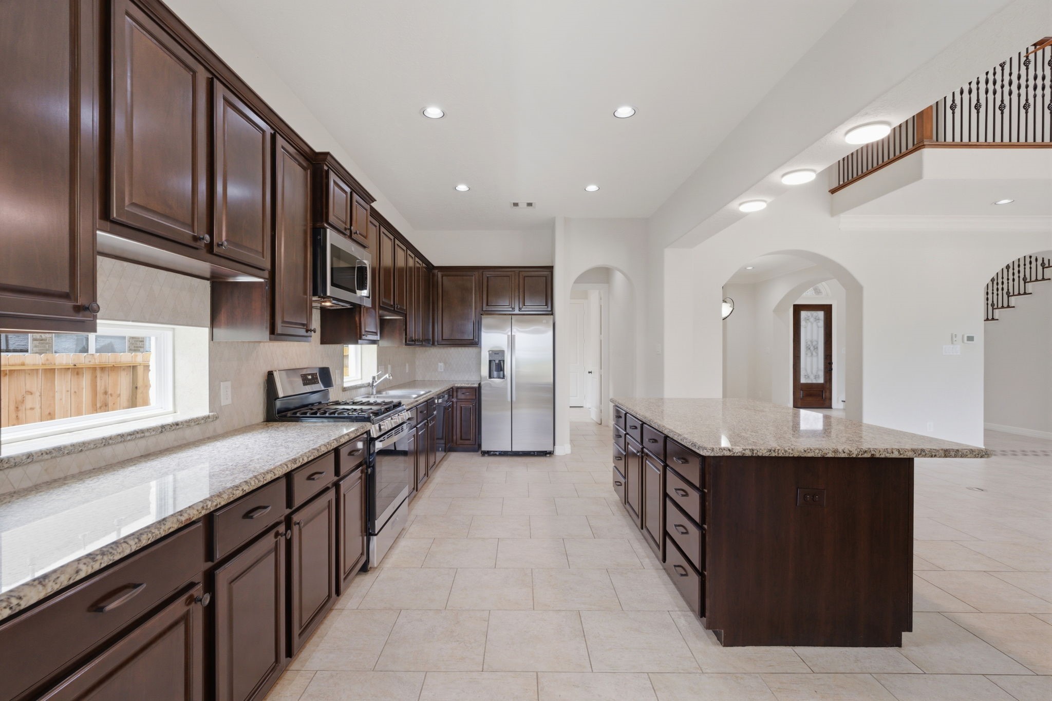 8403 Greenridge Manor Lane Spring, TX 77389 - Photo 12 of 44 The open layout connects seamlessly to the adjacent living areas.