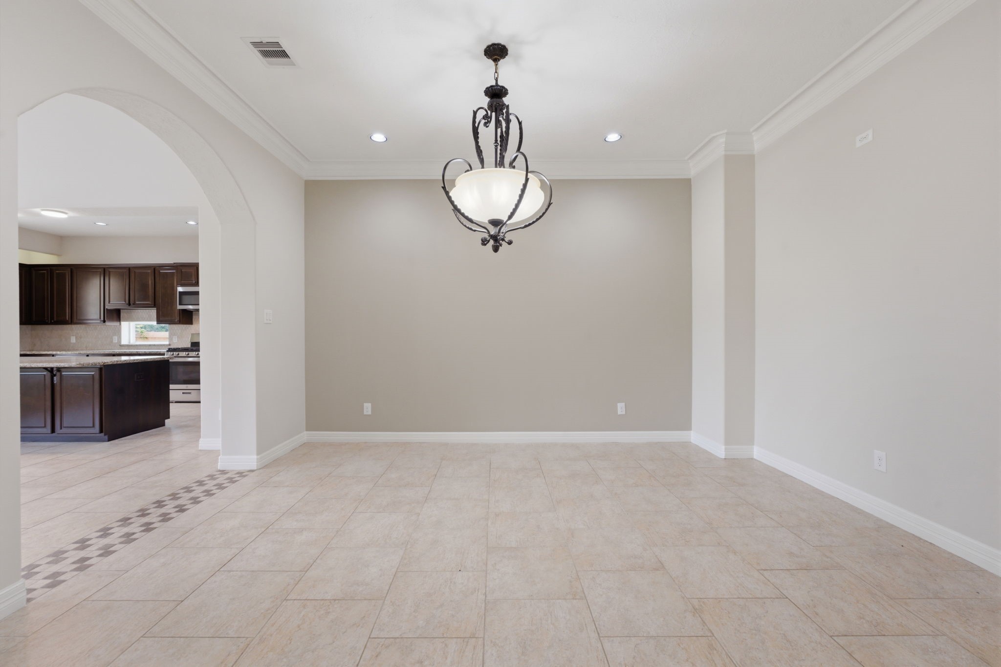 8403 Greenridge Manor Lane Spring, TX 77389 - Photo 16 of 44 Dining area with a stylish chandelier and neutral walls.