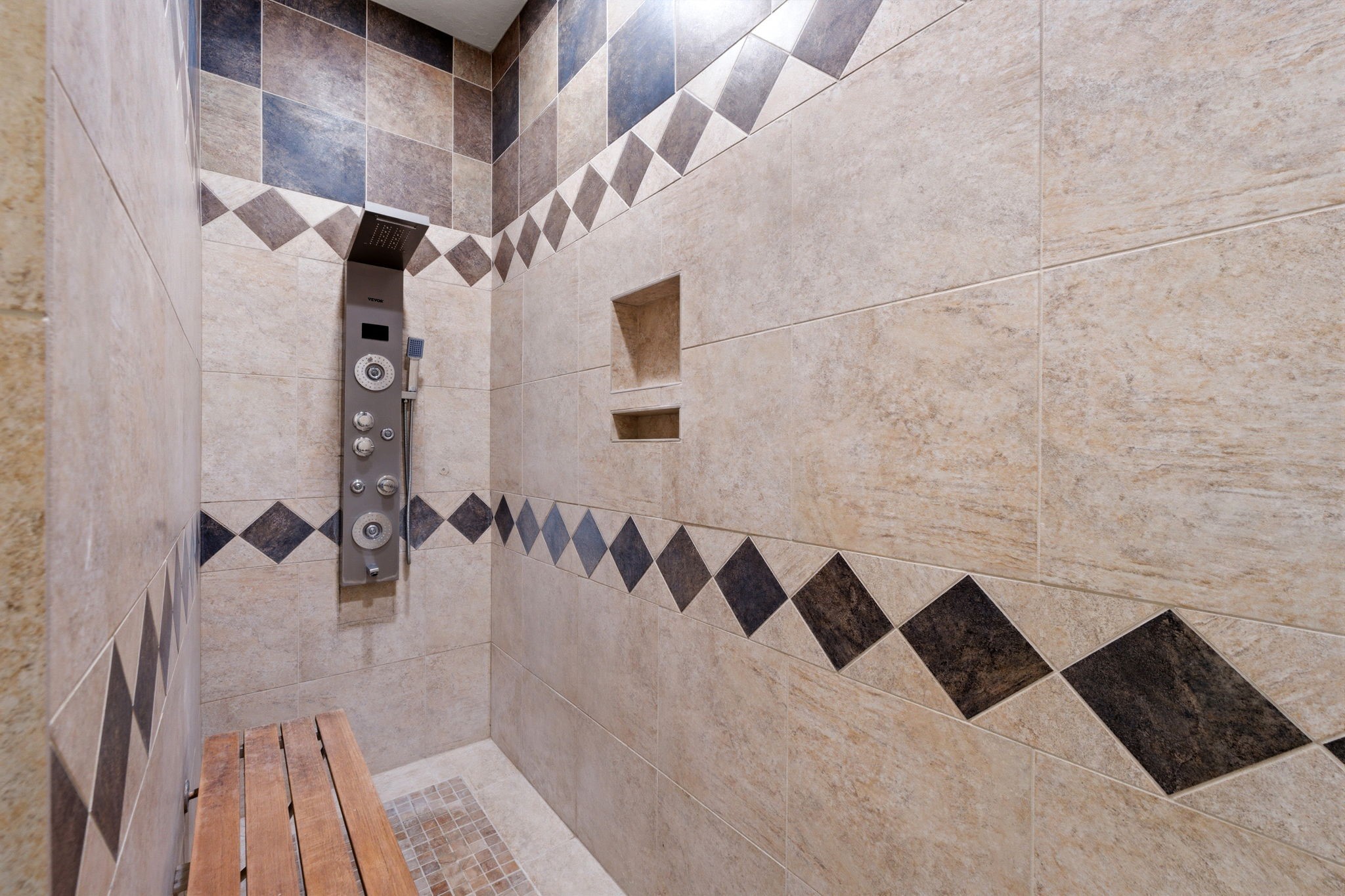 8403 Greenridge Manor Lane Spring, TX 77389 - Photo 23 of 44 Luxurious shower with a built-in bench for a spa-like feel.