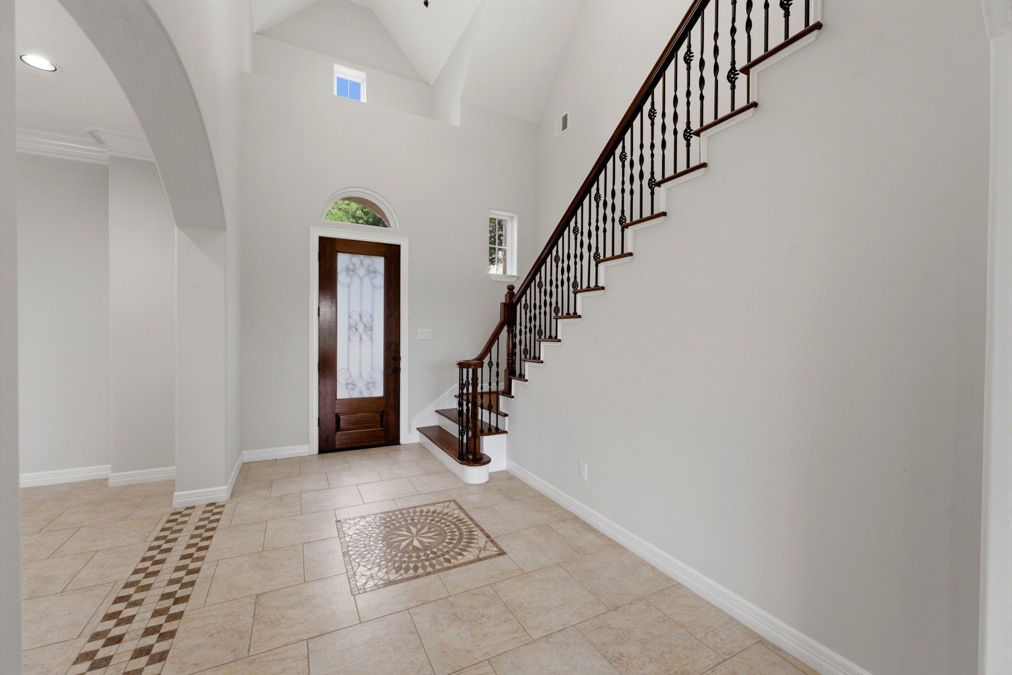 8403 Greenridge Manor Lane Spring, TX 77389 - Photo 6 of 44 Elegant entryway with high ceilings and decorative tile inlay.