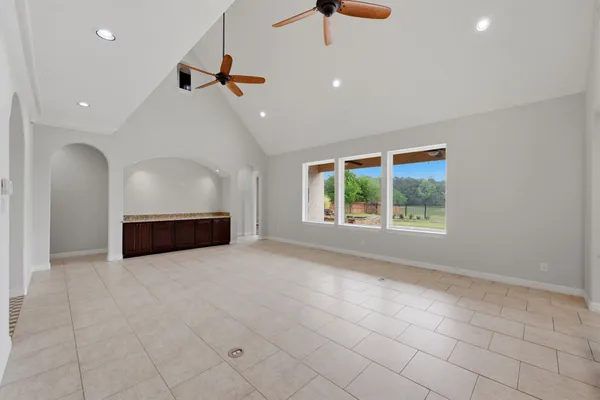 a view of a room with window and entryway
