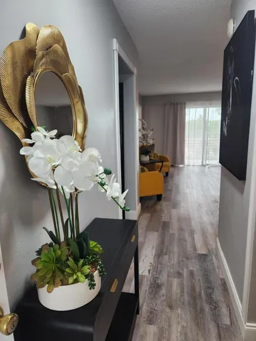 a bedroom with a bed and a night stand