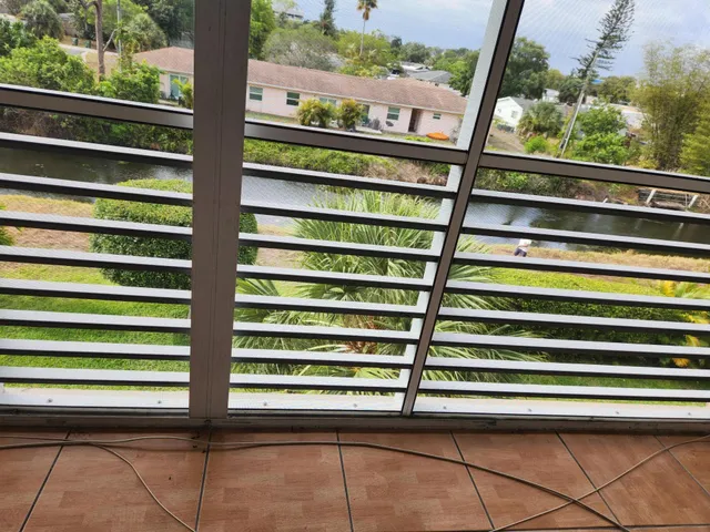 a view of a kitchen with refrigerator and cabinet