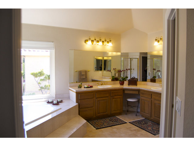 361 Eagle Trace Drive Half Moon Bay, CA 94019 - Photo 14 of 25 a bathroom with a sink mirror and a bathtub
