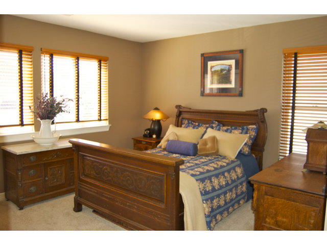 361 Eagle Trace Drive Half Moon Bay, CA 94019 - Photo 18 of 25 a bedroom with a bed and two windows