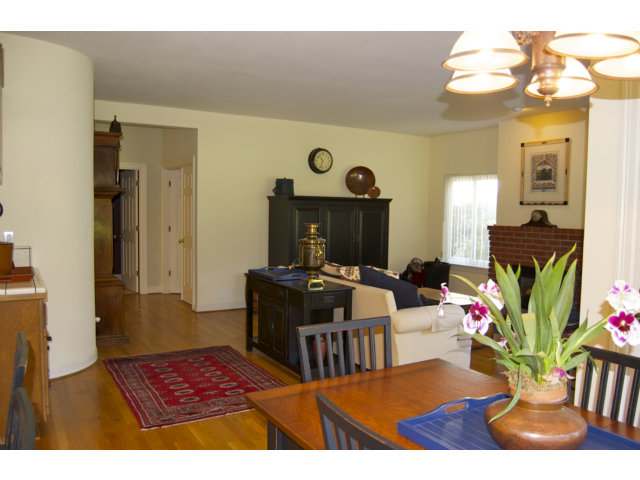 361 Eagle Trace Drive Half Moon Bay, CA 94019 - Photo 6 of 25 a living room with furniture dining table and a chandelier