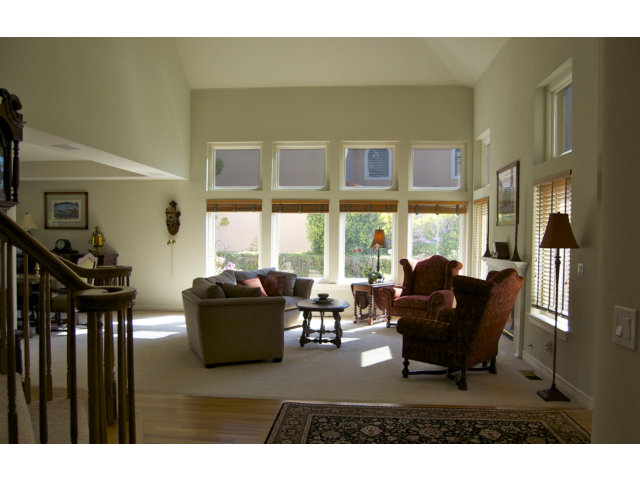 361 Eagle Trace Drive Half Moon Bay, CA 94019 - Photo 9 of 25 a living room with furniture and large windows