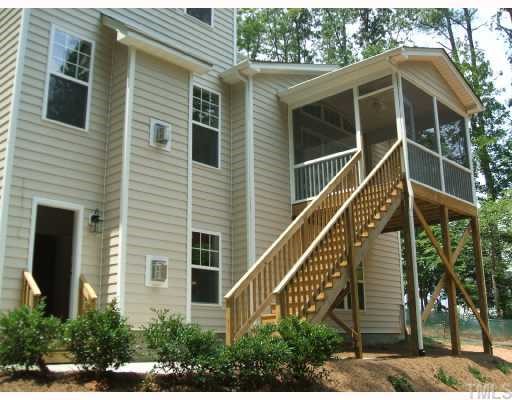 204 Forbes Road Wake Forest, NC 27587 - Photo 11 of 12 Spacious outdoor living areas include the screened porch and enlarged patio.