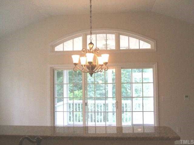 204 Forbes Road Wake Forest, NC 27587 - Photo 6 of 12 The Grand Morning room w/breakfast bar open to the kitchen on one side and screened porch on the other.