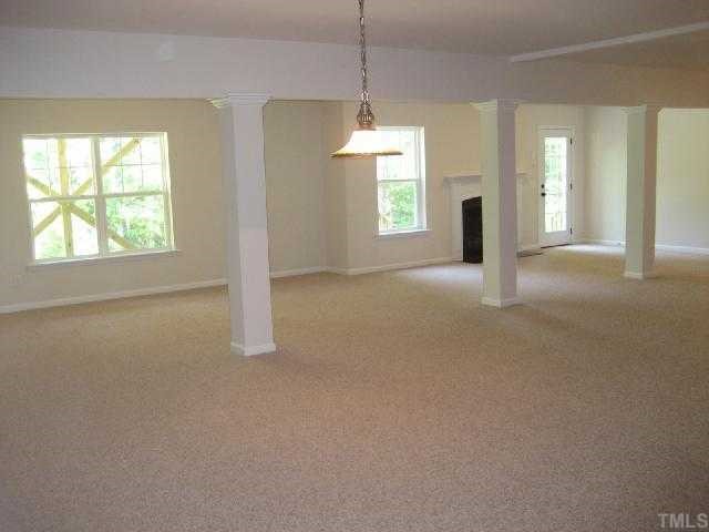 204 Forbes Road Wake Forest, NC 27587 - Photo 10 of 12 Partially finished space is expansive and includes a bedroom and full bath, concrete patio, and large are of unfinished space for storage.